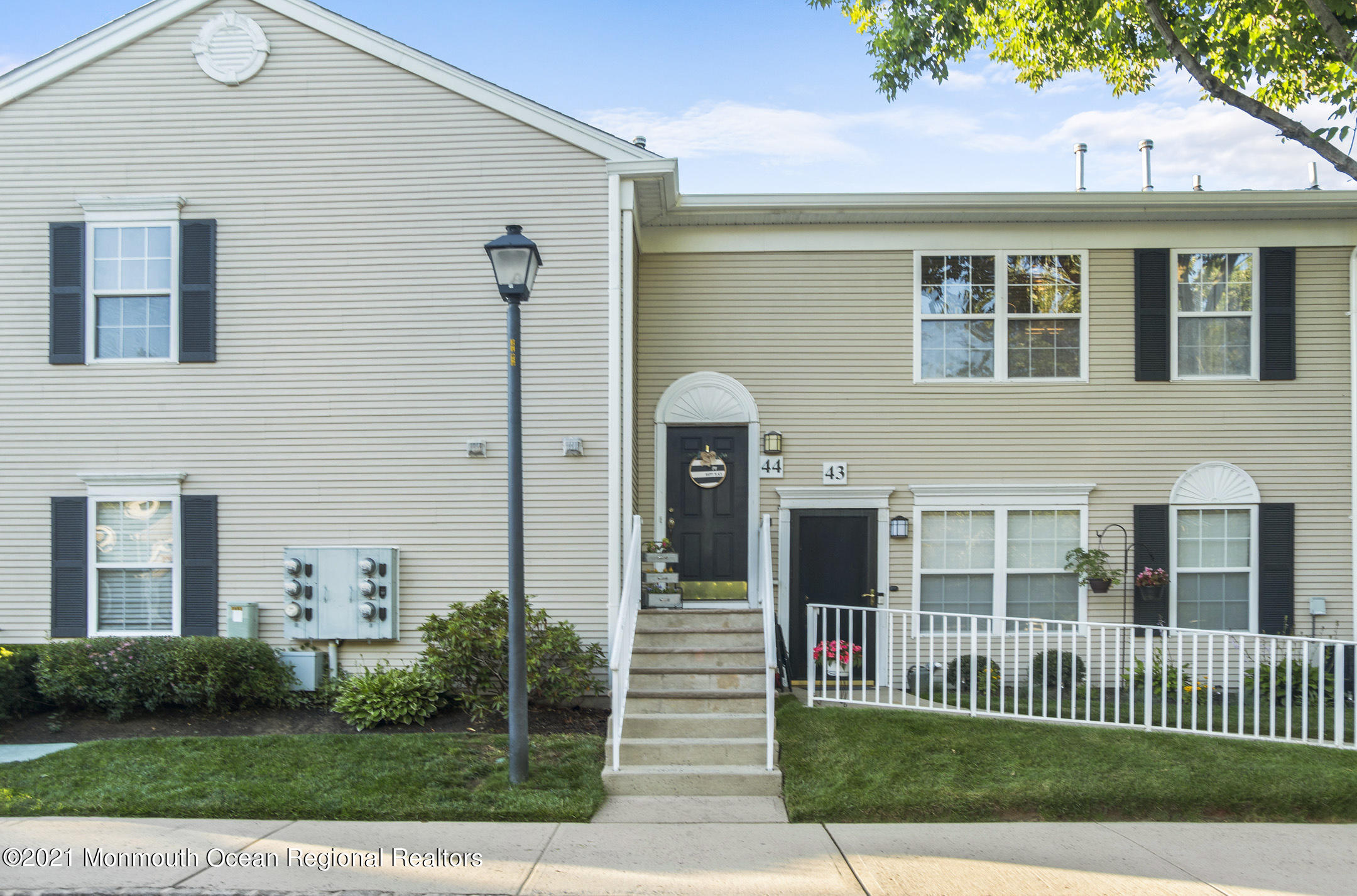 44 Prestwick Road Manalapan, NJ 07726 - Photo 12 of 15 a front view of a house with a yard