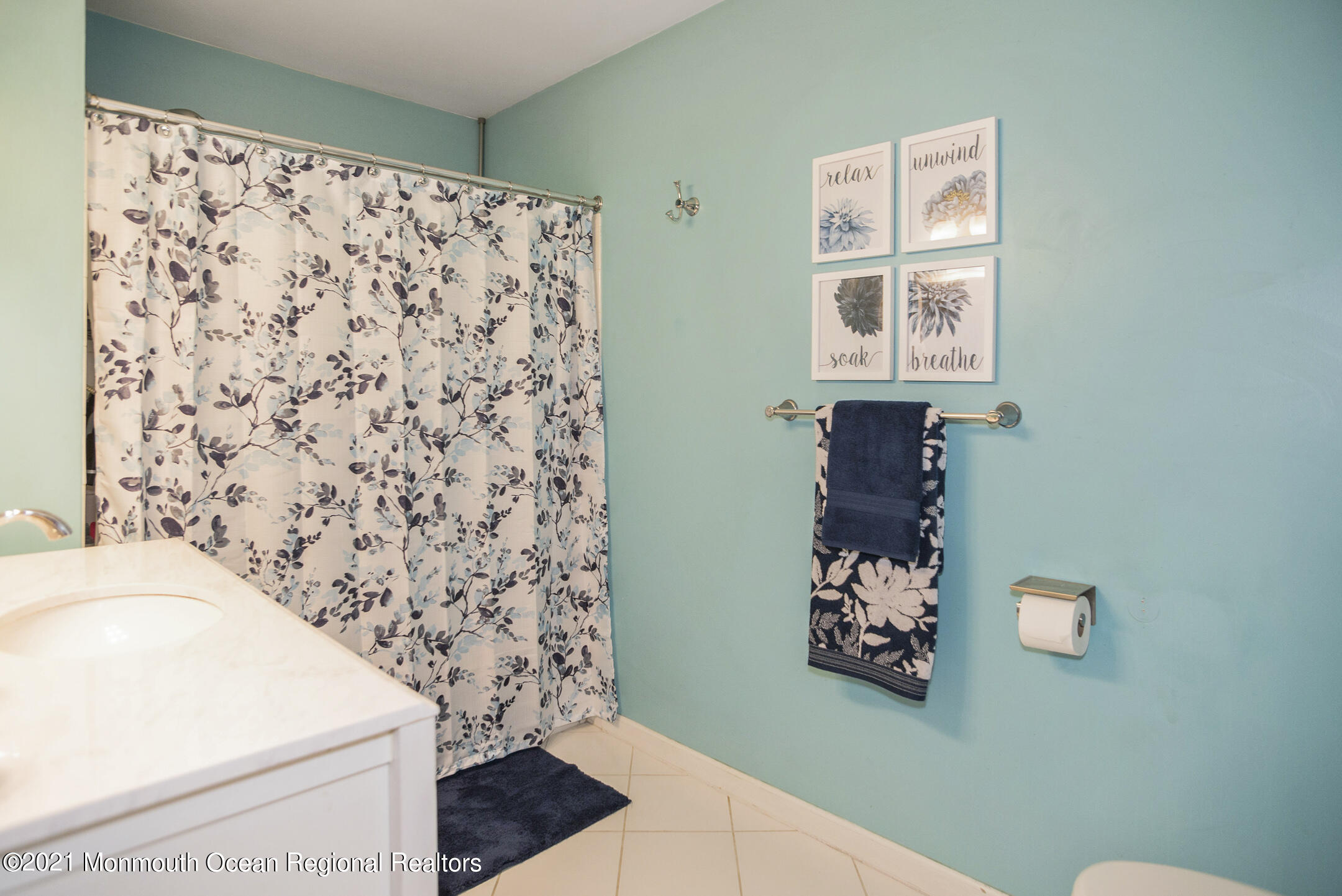 44 Prestwick Road Manalapan, NJ 07726 - Photo 14 of 15 a bathroom with a toilet and a shower curtain