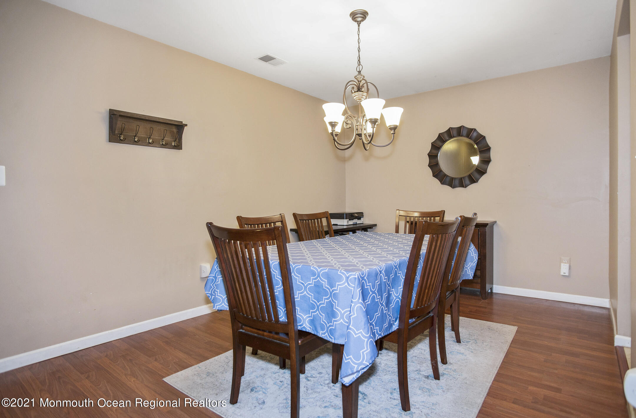 44 Prestwick Road Manalapan, NJ 07726 - Photo 5 of 15 a view of a dining room with furniture and wooden floor