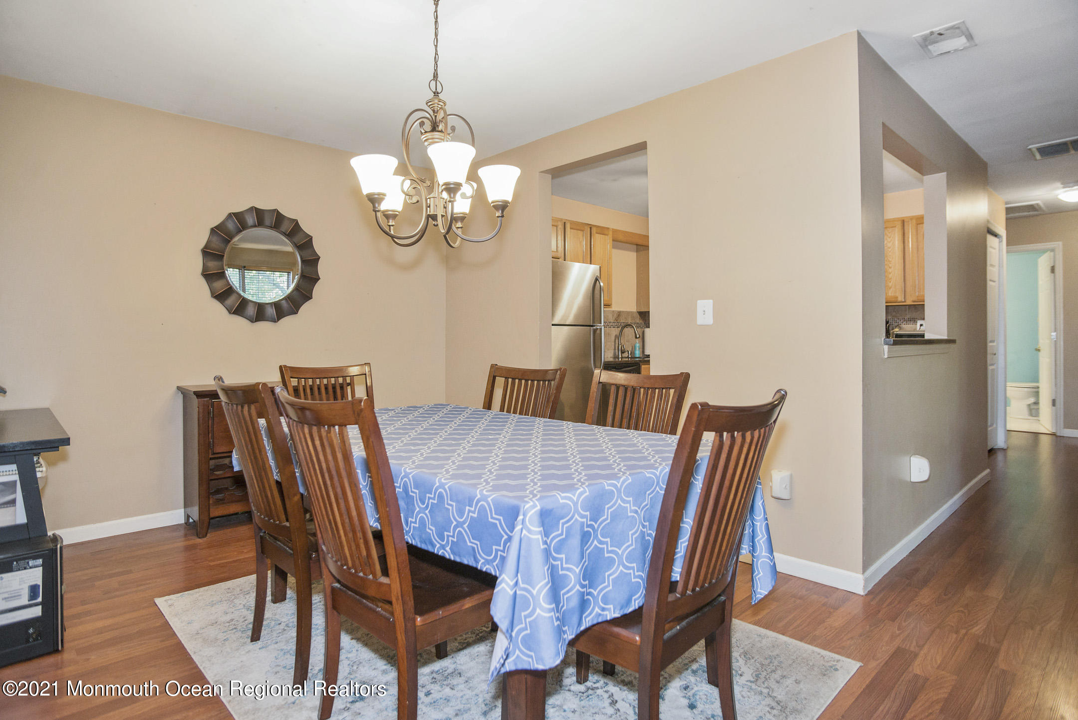 44 Prestwick Road Manalapan, NJ 07726 - Photo 6 of 15 a view of a dining room with furniture wooden floor and chandelier