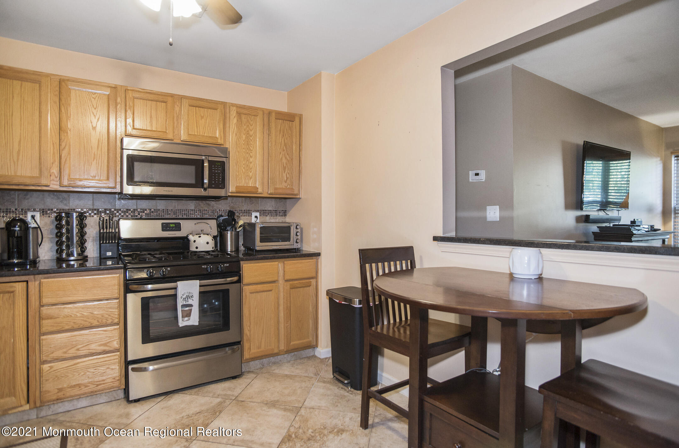 44 Prestwick Road Manalapan, NJ 07726 - Photo 7 of 15 a kitchen with a stove a sink and a microwave