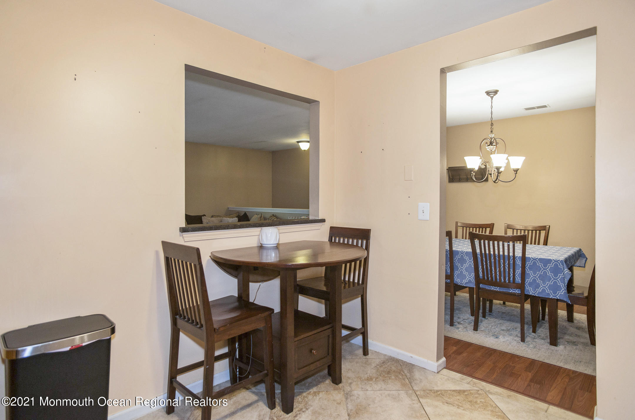 44 Prestwick Road Manalapan, NJ 07726 - Photo 9 of 15 a view of a dining room with furniture and wooden floor