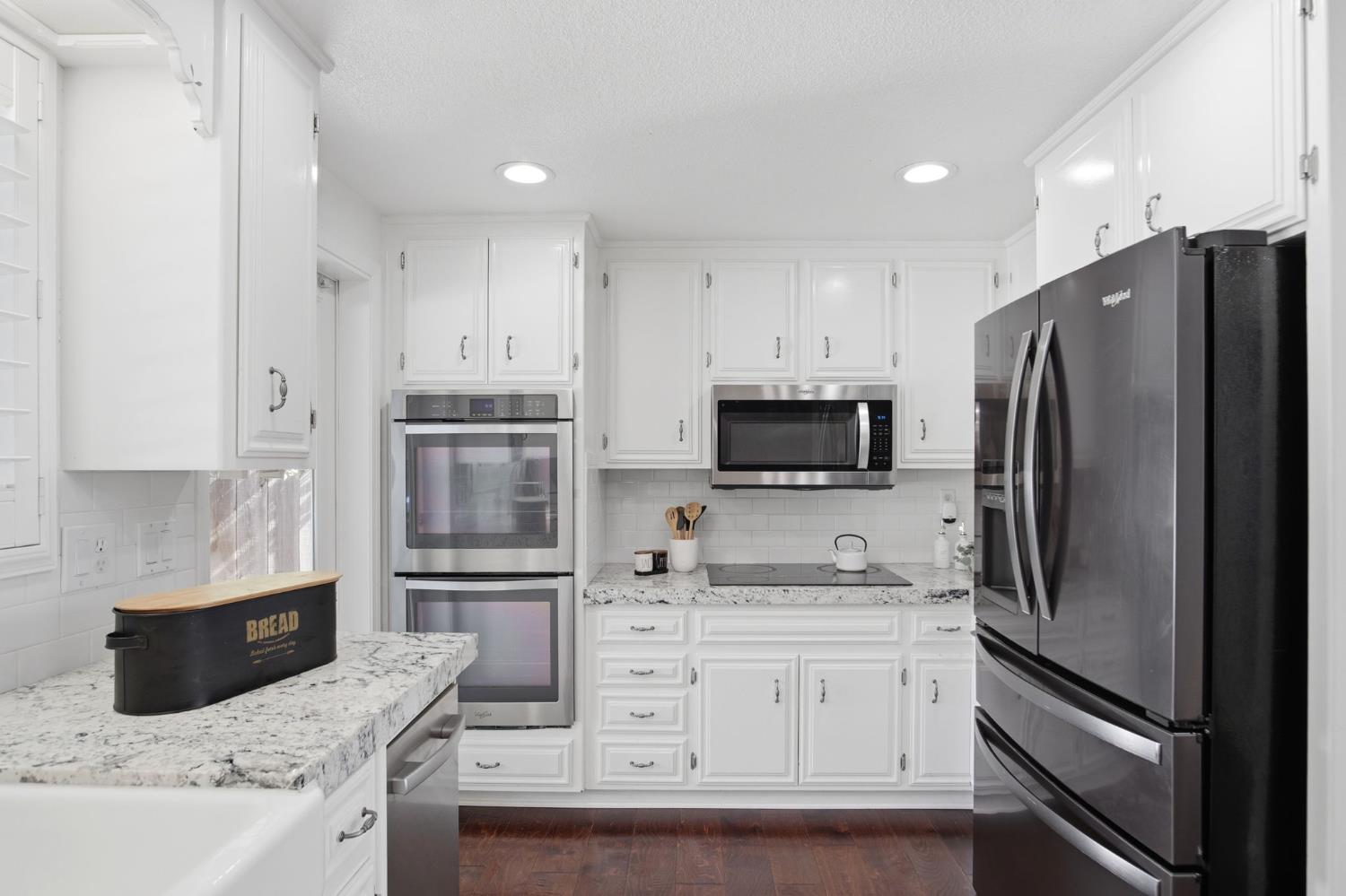 10401 Golf Link Road Turlock, CA 95380 - Photo 13 of 63 a kitchen with stainless steel appliances cabinets and a refrigerator