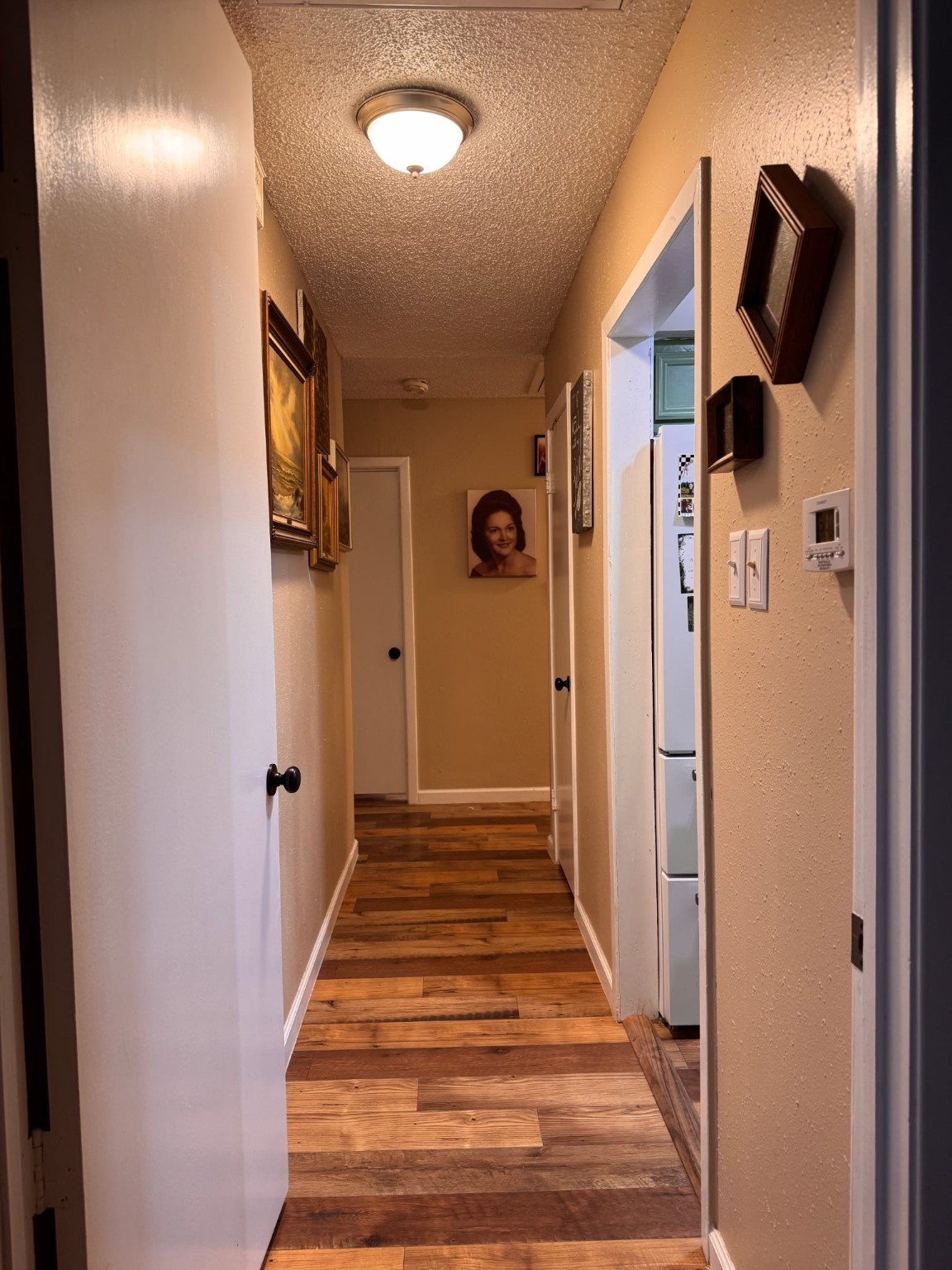 75 Coral Gables Trinity, TX 75862 - Photo 13 of 22 a view of a hallway with wooden floor and staircase