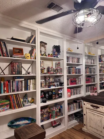 a view of a book shelf with lots of books