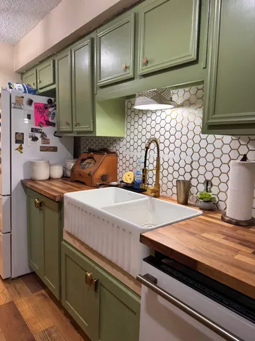 a kitchen with a sink and cabinets