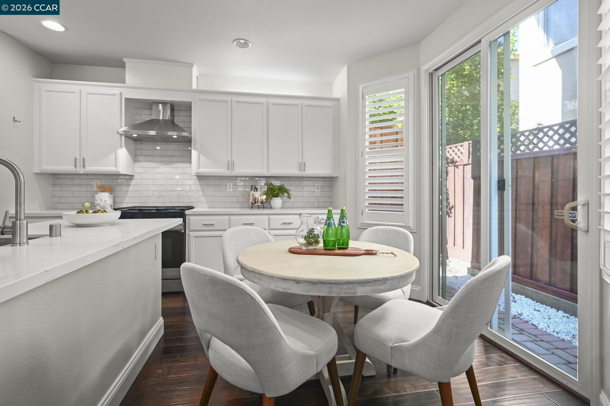 16 Poppy Hills Lane San Ramon, CA 94583 - Photo 11 of 30 a kitchen with stainless steel appliances a dining table and chairs