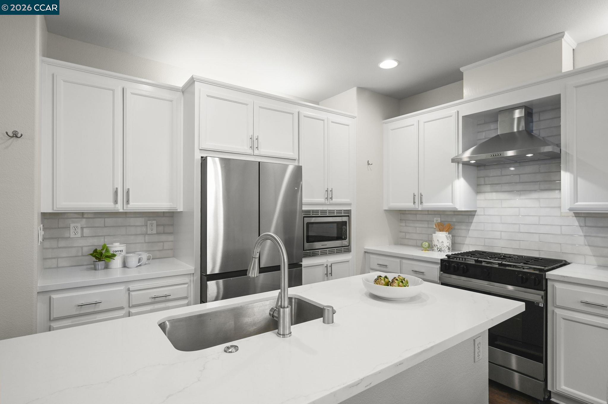16 Poppy Hills Lane San Ramon, CA 94583 - Photo 12 of 30 a kitchen with a sink a stove and refrigerator