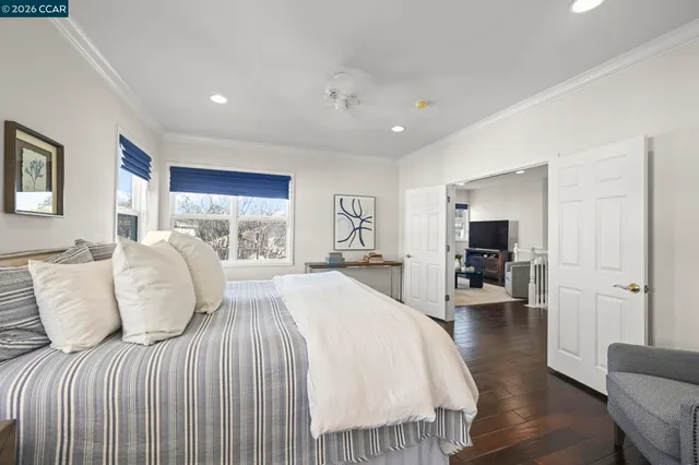 a bedroom with double bed and a large window