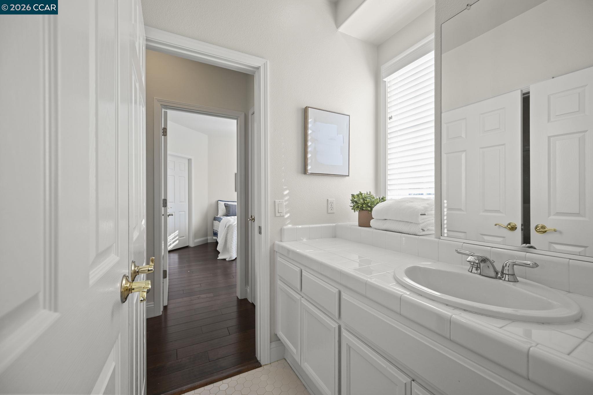 16 Poppy Hills Lane San Ramon, CA 94583 - Photo 22 of 30 a bathroom with a sink and a mirror