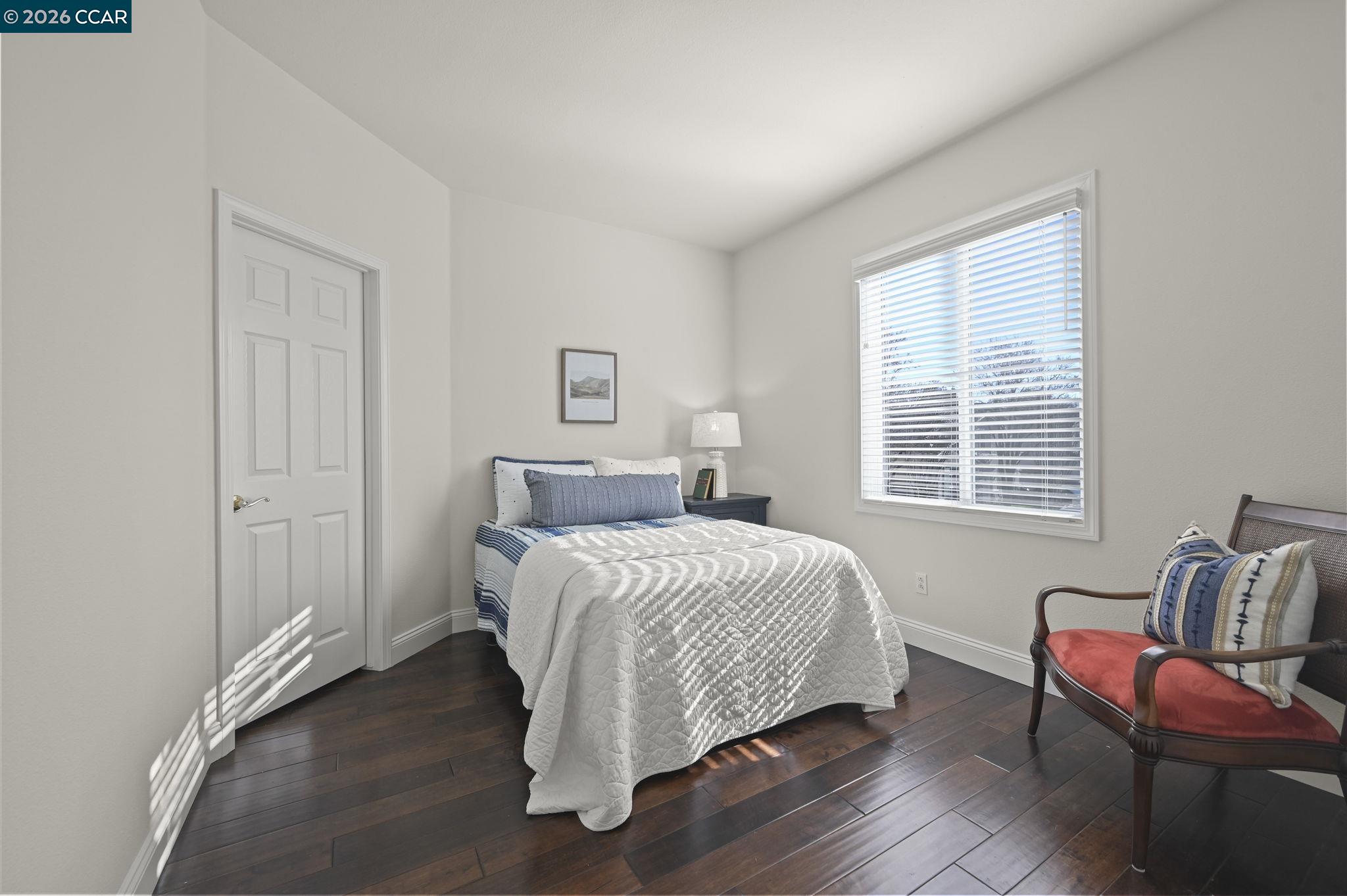 16 Poppy Hills Lane San Ramon, CA 94583 - Photo 23 of 30 a bedroom with a bed and a chair