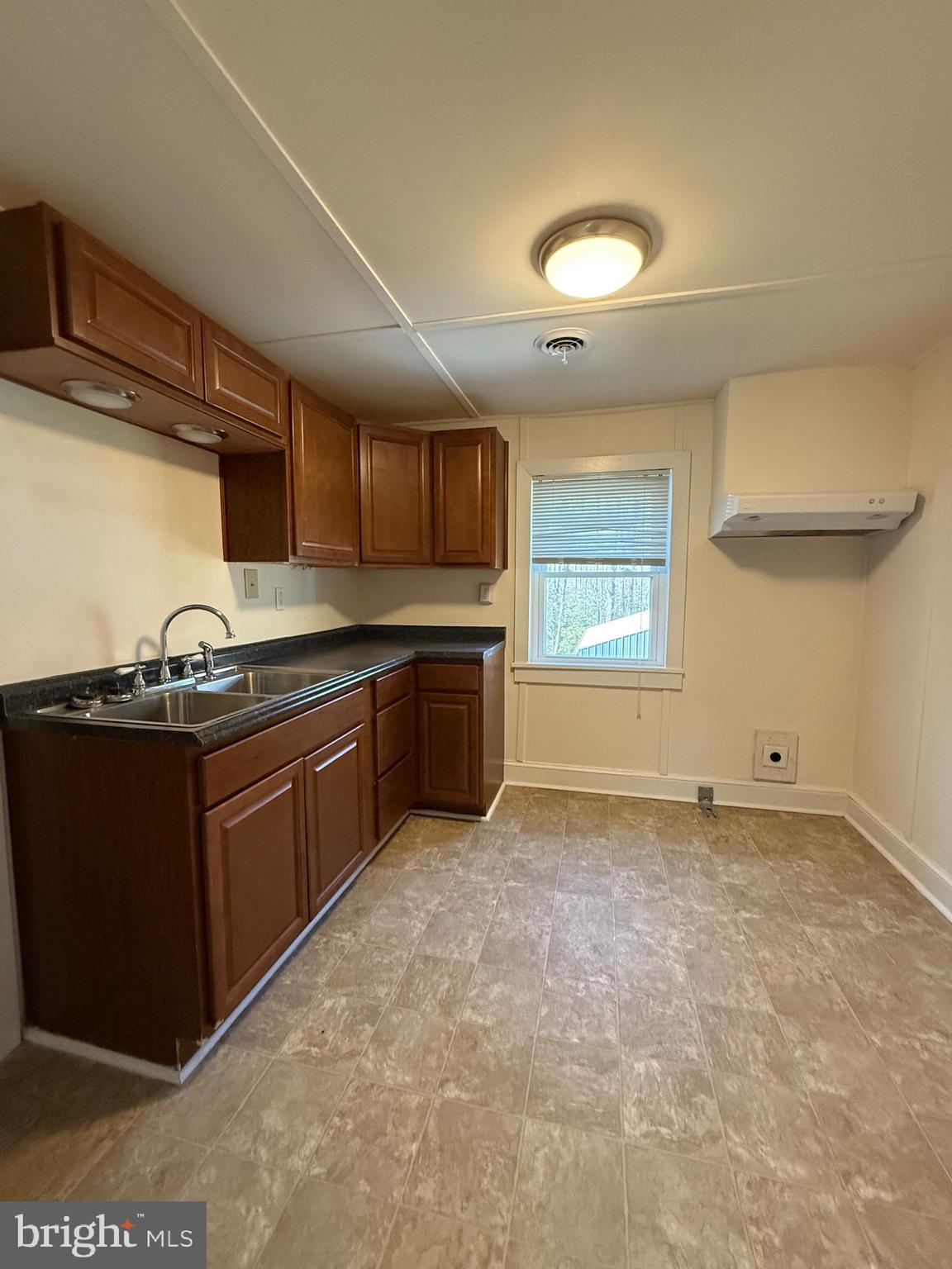 9253 Dahlgren Road King George, VA 22485 - Photo 12 of 23 a kitchen with granite countertop a sink and a stove