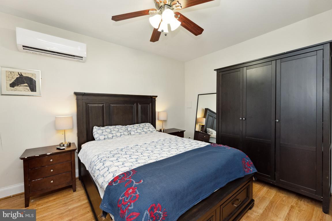 428 8th Street Southeast, Unit A Washington, DC 20003 - Photo 12 of 23 a bedroom with a bed and a dresser