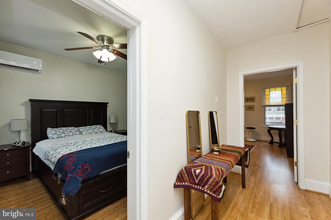 428 8th Street Southeast, Unit A Washington, DC 20003 - Photo 15 of 23 a bedroom with a bed and wooden floor