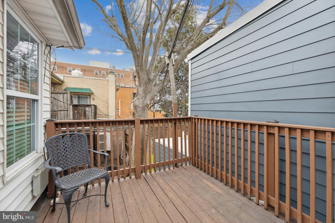 428 8th Street Southeast, Unit A Washington, DC 20003 - Photo 16 of 23 a view of a balcony with wooden chairs