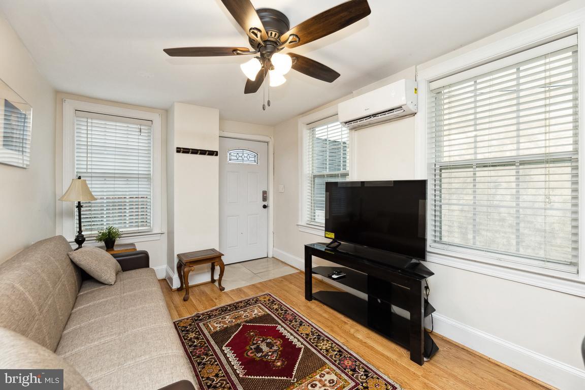 428 8th Street Southeast, Unit A Washington, DC 20003 - Photo 20 of 23 a living room with furniture and a flat screen tv