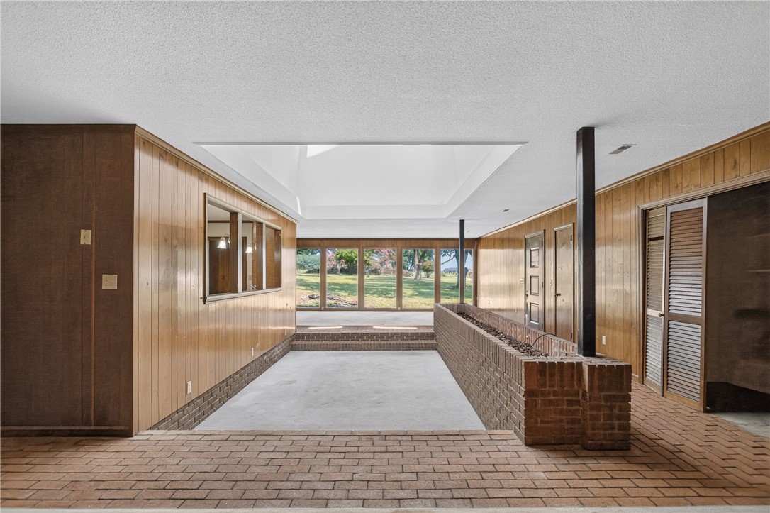 1412 Simpson Road Pendleton, SC 29670 - Photo 10 of 48 A spacious sunken living area features a bright skylight and a wall of windows overlooking the landscape.