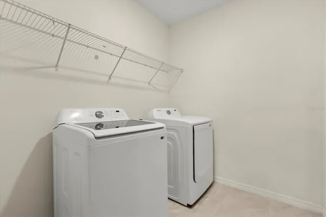 a utility room with dryer and washer