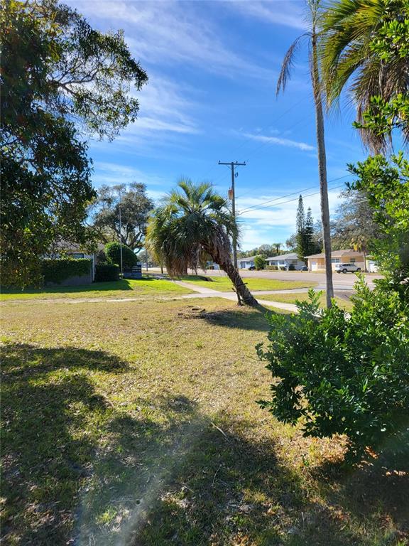 2131 Northeast Coachman Road Clearwater, FL 33765 - Photo 6 of 11 a view of a lake with a yard