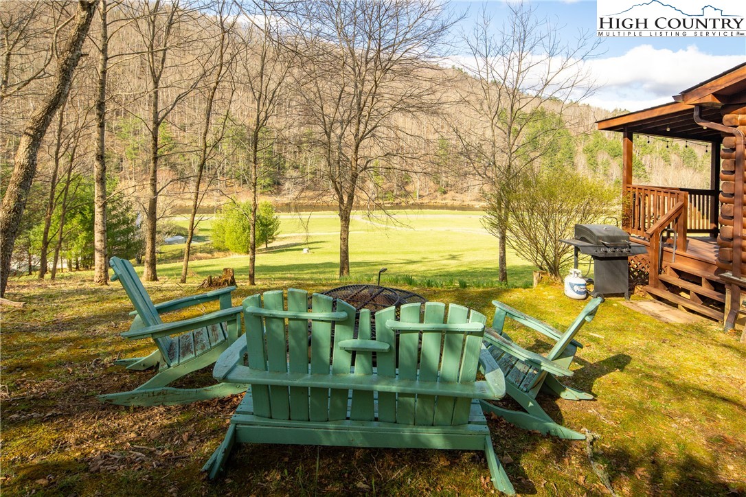 2408 Todd Railroad Grade Road Todd, NC 28684 - Photo 4 of 46 a view of a swimming pool with a patio and a yard