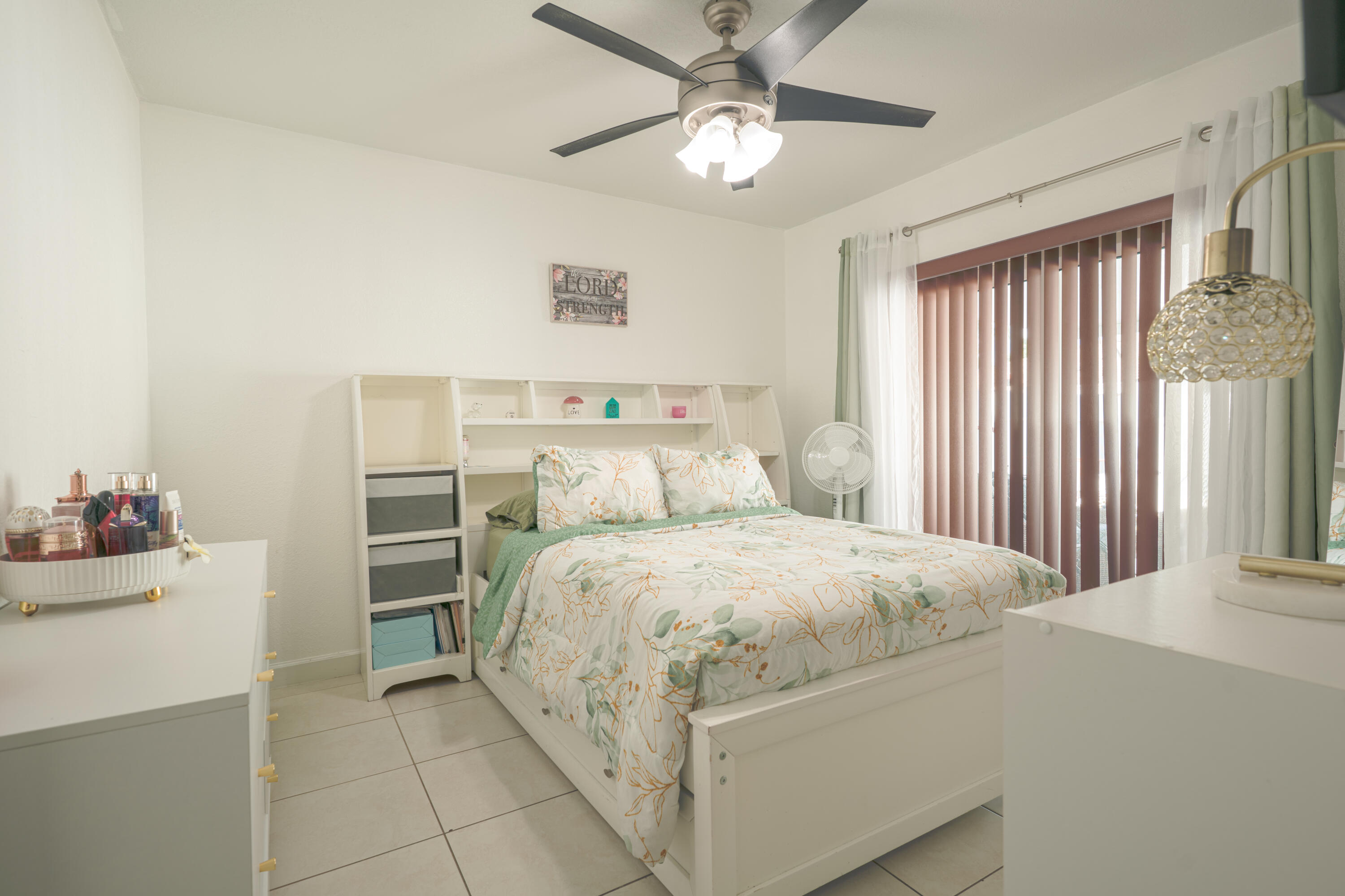 13257 Southwest 277th Terrace Homestead, FL 33032 - Photo 13 of 24 a bedroom with a bed and a chandelier