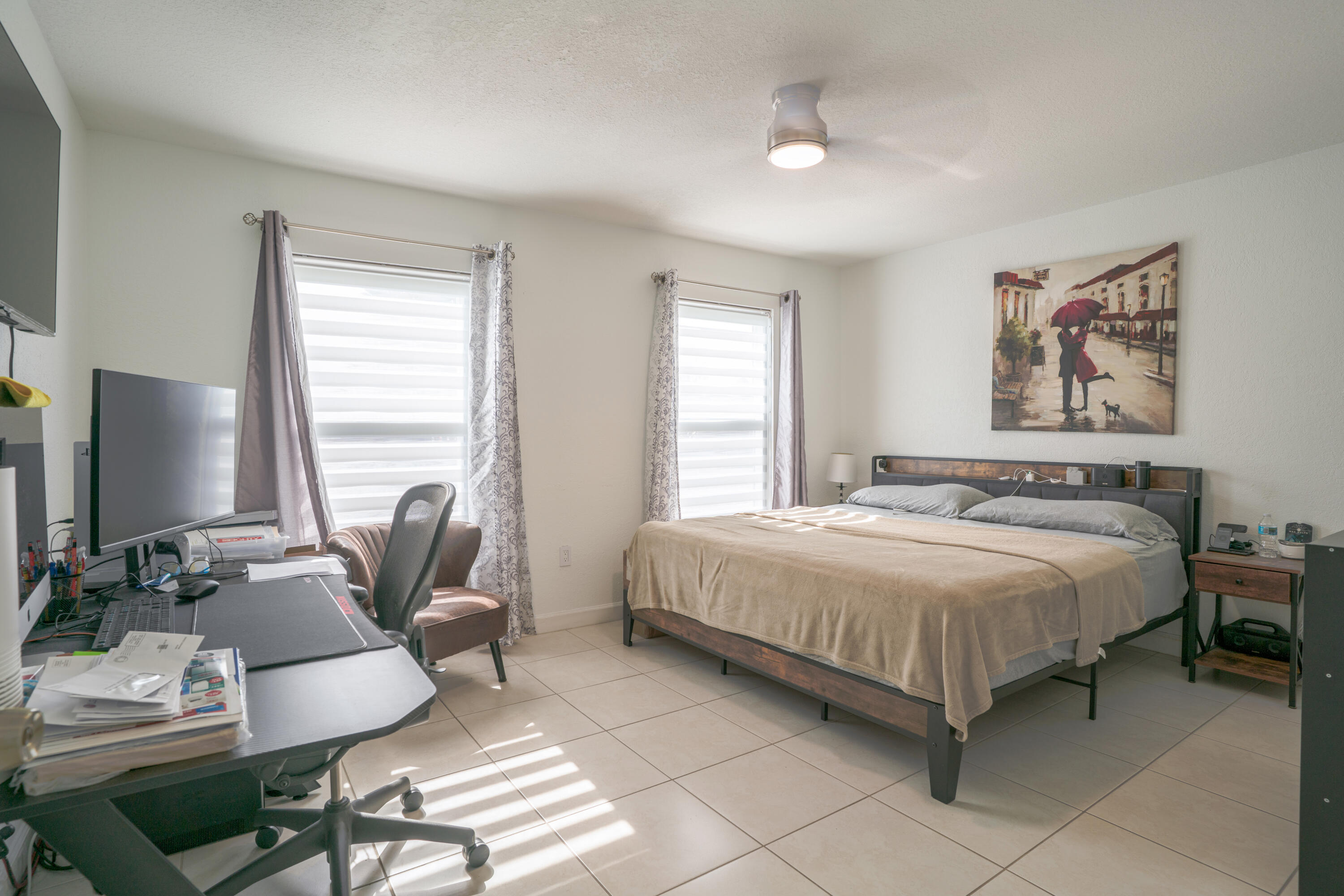 13257 Southwest 277th Terrace Homestead, FL 33032 - Photo 16 of 24 a bedroom with a bed a couch and a window