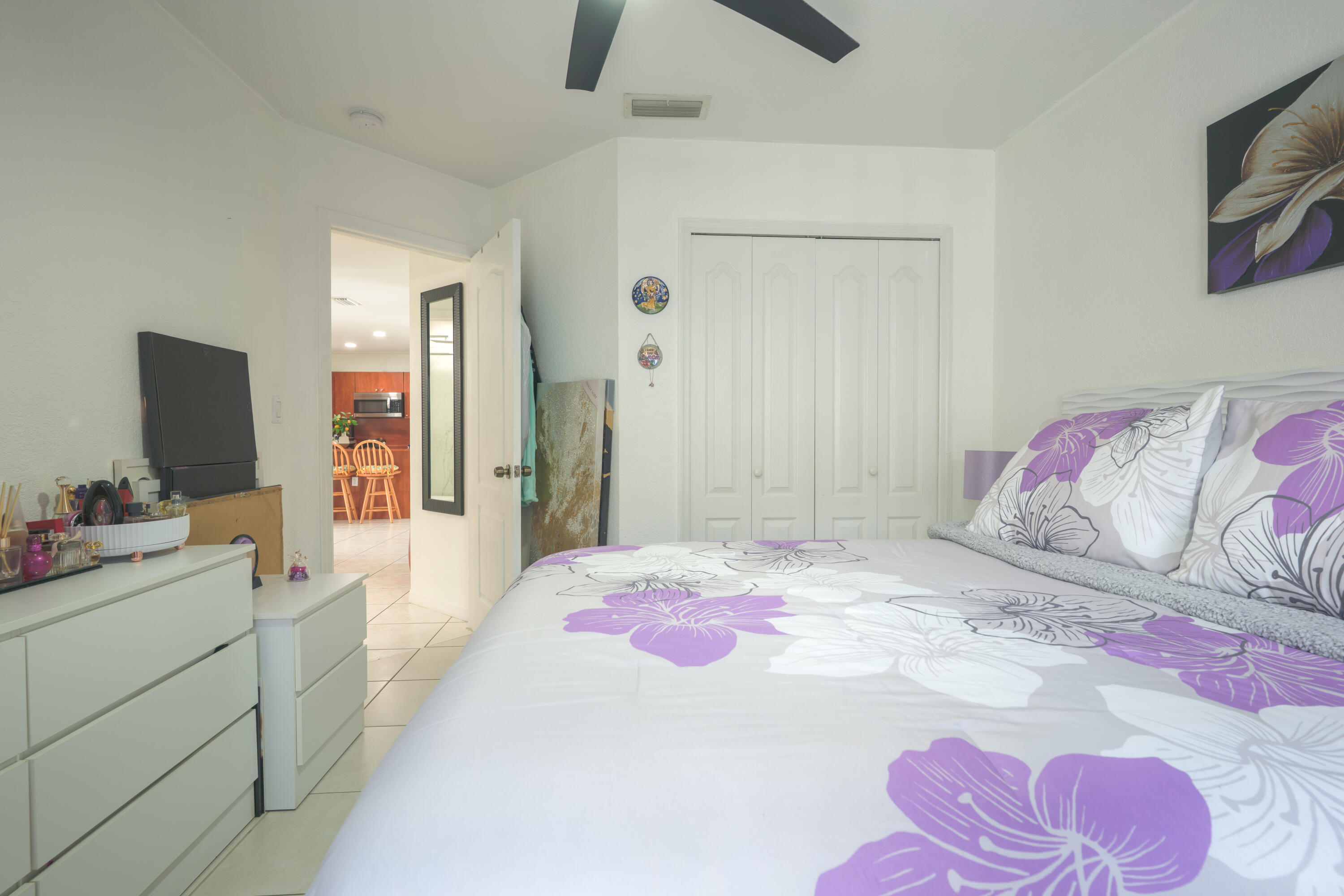 13257 Southwest 277th Terrace Homestead, FL 33032 - Photo 19 of 24 a bedroom with a bed and a chandelier