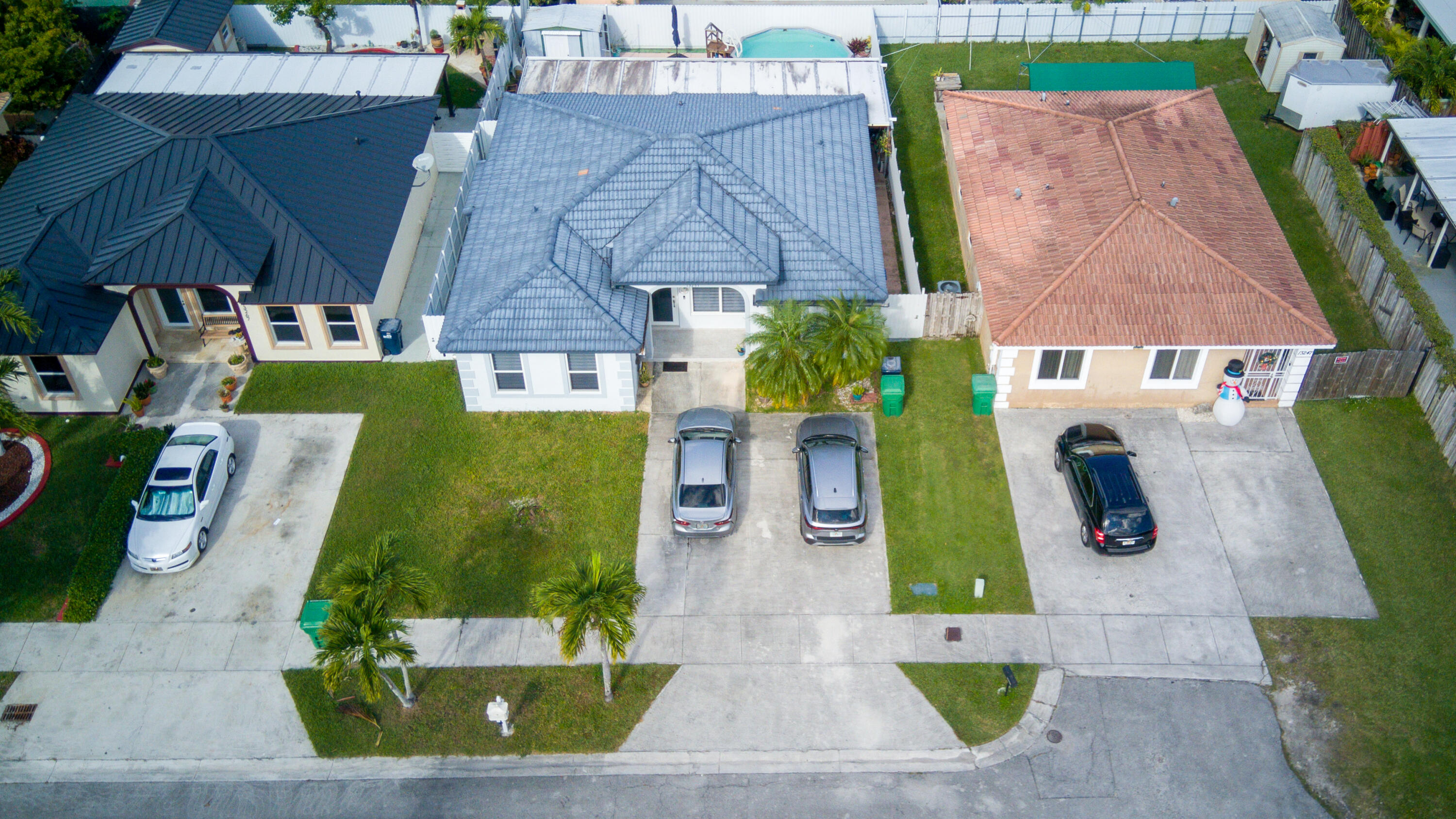 13257 Southwest 277th Terrace Homestead, FL 33032 - Photo 2 of 24 an aerial view of multiple houses with outdoor space