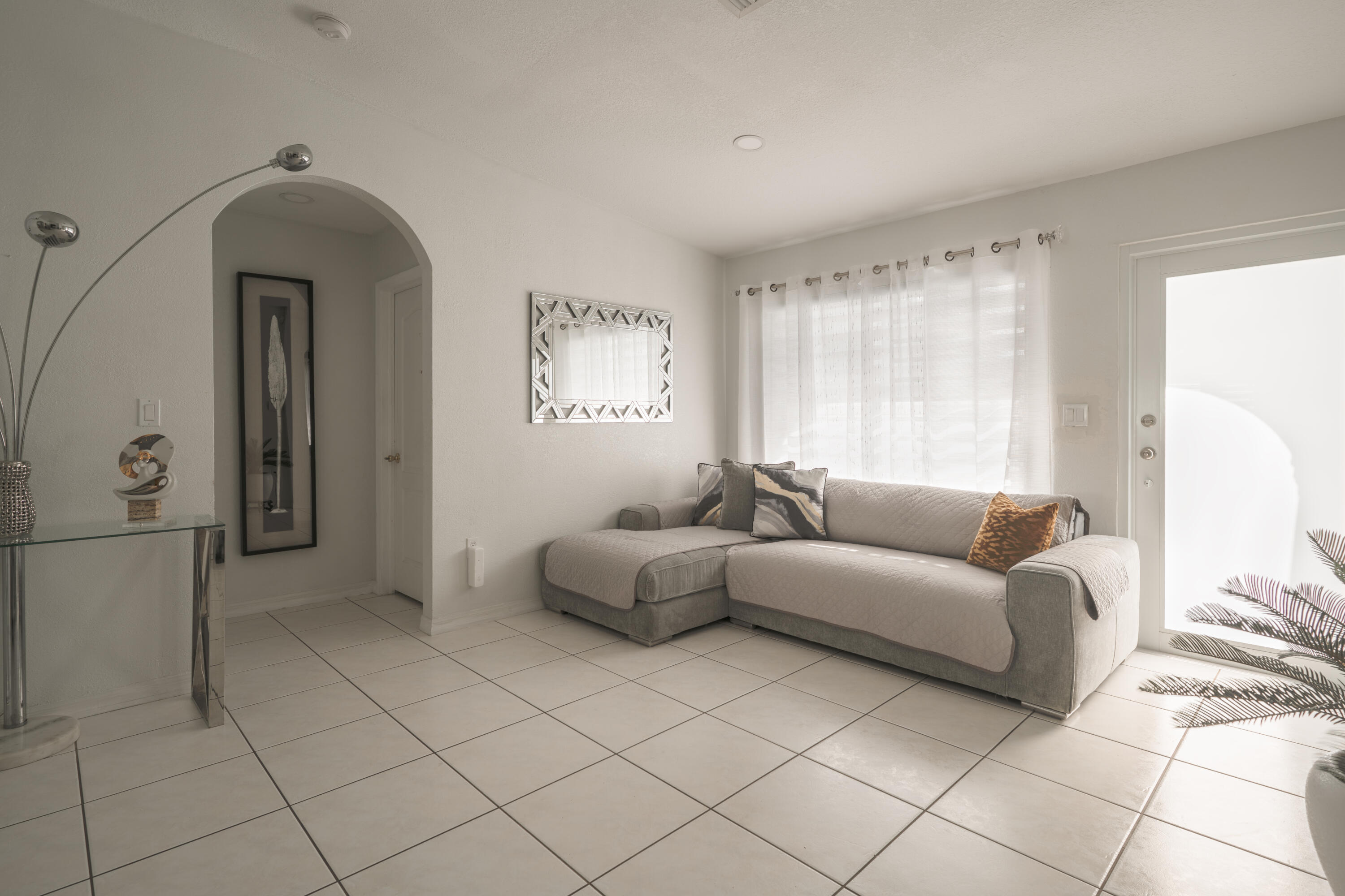 13257 Southwest 277th Terrace Homestead, FL 33032 - Photo 5 of 24 a living room with furniture and a window