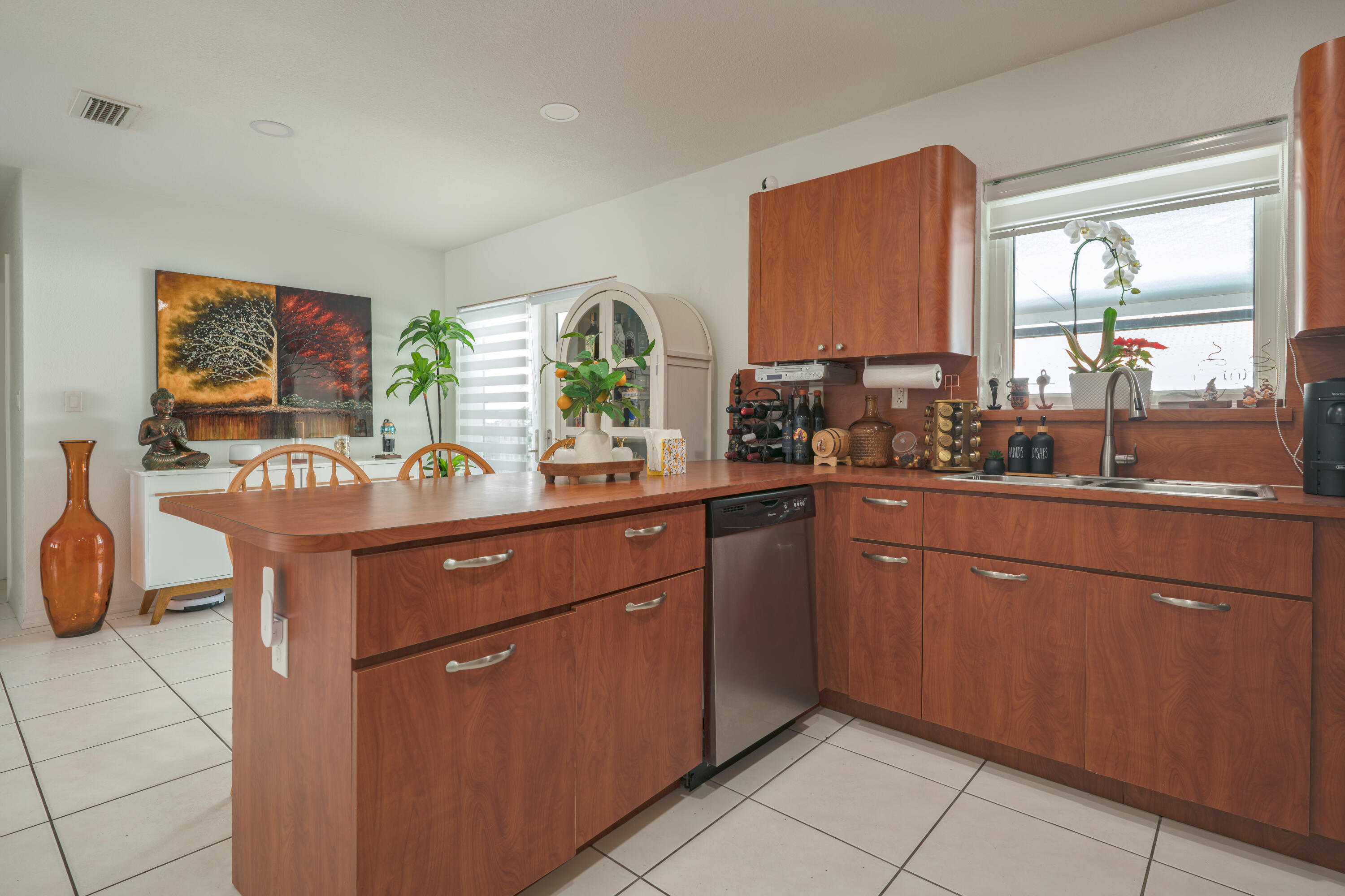 13257 Southwest 277th Terrace Homestead, FL 33032 - Photo 9 of 24 a kitchen with stainless steel appliances granite countertop a sink counter space and a large window