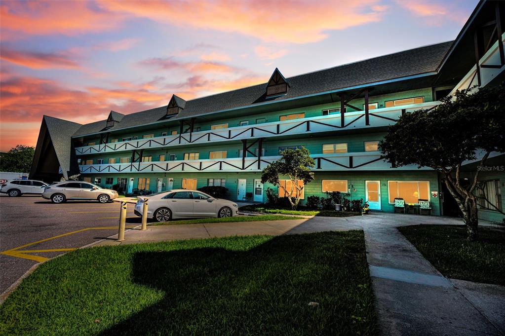 2043 Denmark Street, Unit 39 Clearwater, FL 33763 - Photo 37 of 37 a view of a building with a patio and a yard