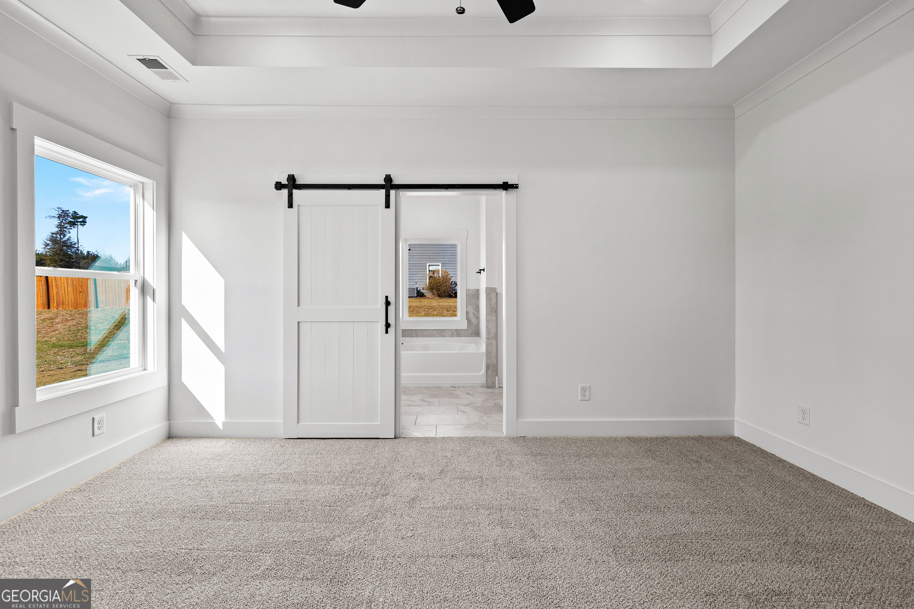 374 Conner Lane Williamson, GA 30292 - Photo 18 of 52 an empty room with windows and closet