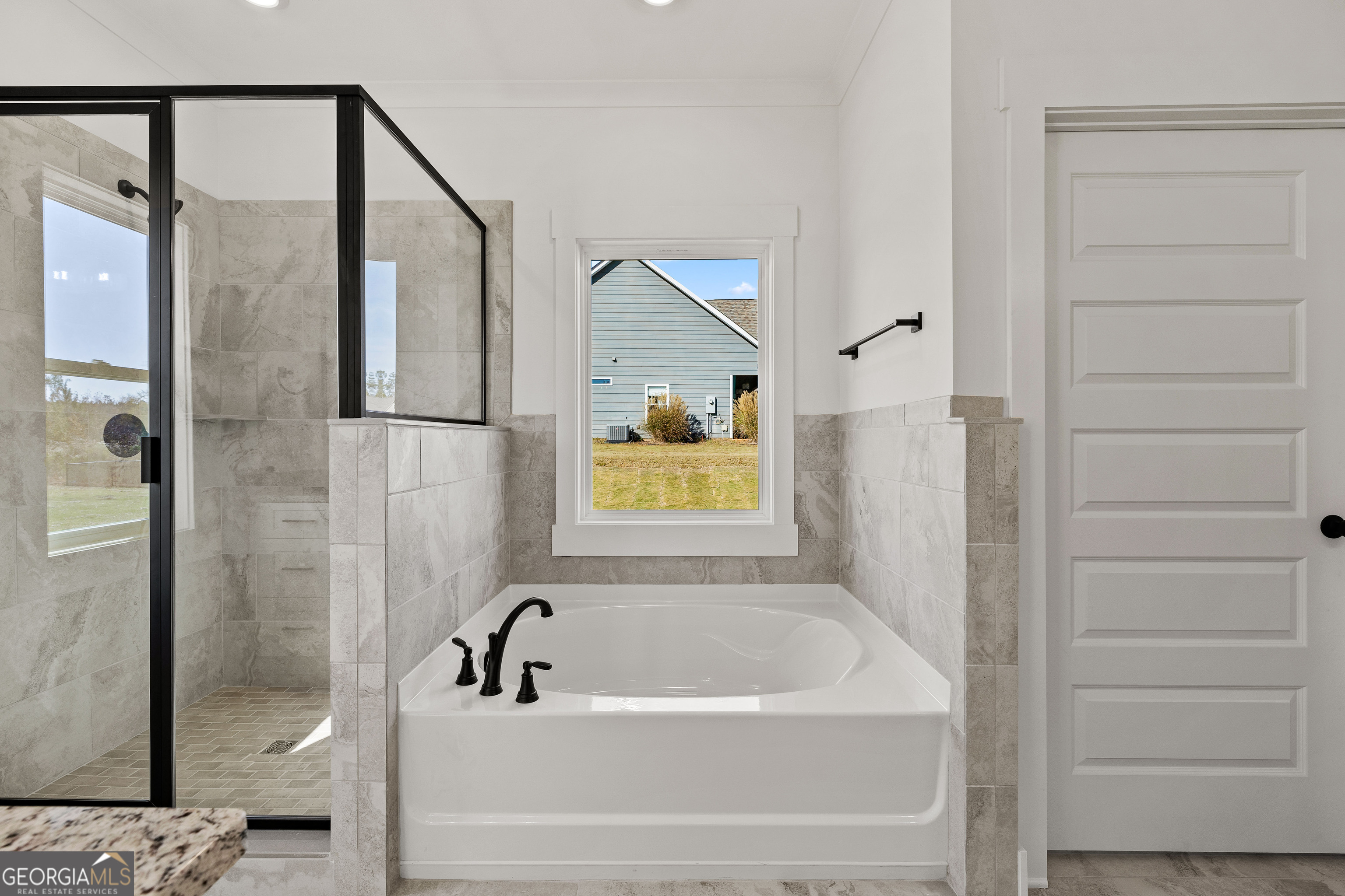 374 Conner Lane Williamson, GA 30292 - Photo 19 of 52 a bathroom with a bathtub and shower