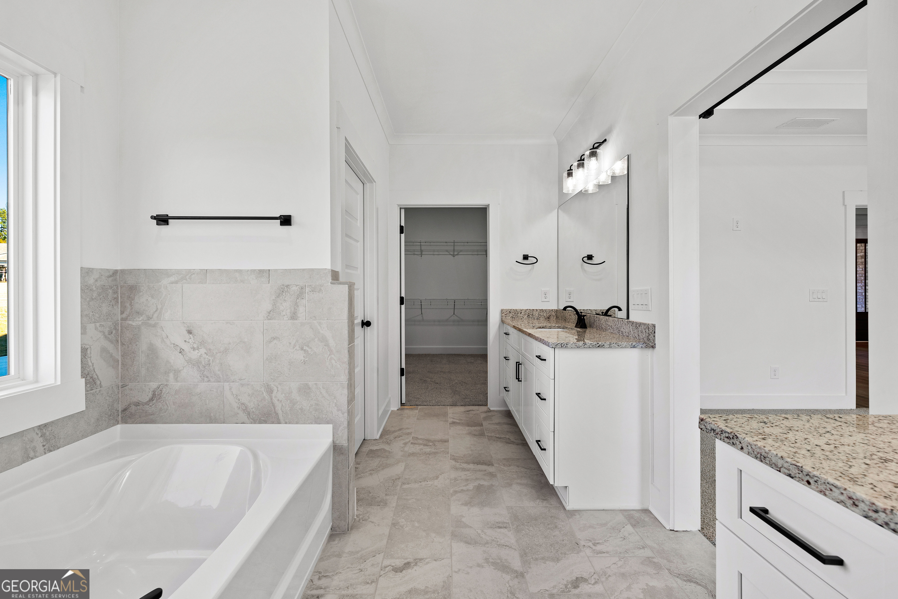 374 Conner Lane Williamson, GA 30292 - Photo 21 of 52 a bathroom with a granite countertop sink a mirror and a bathtub