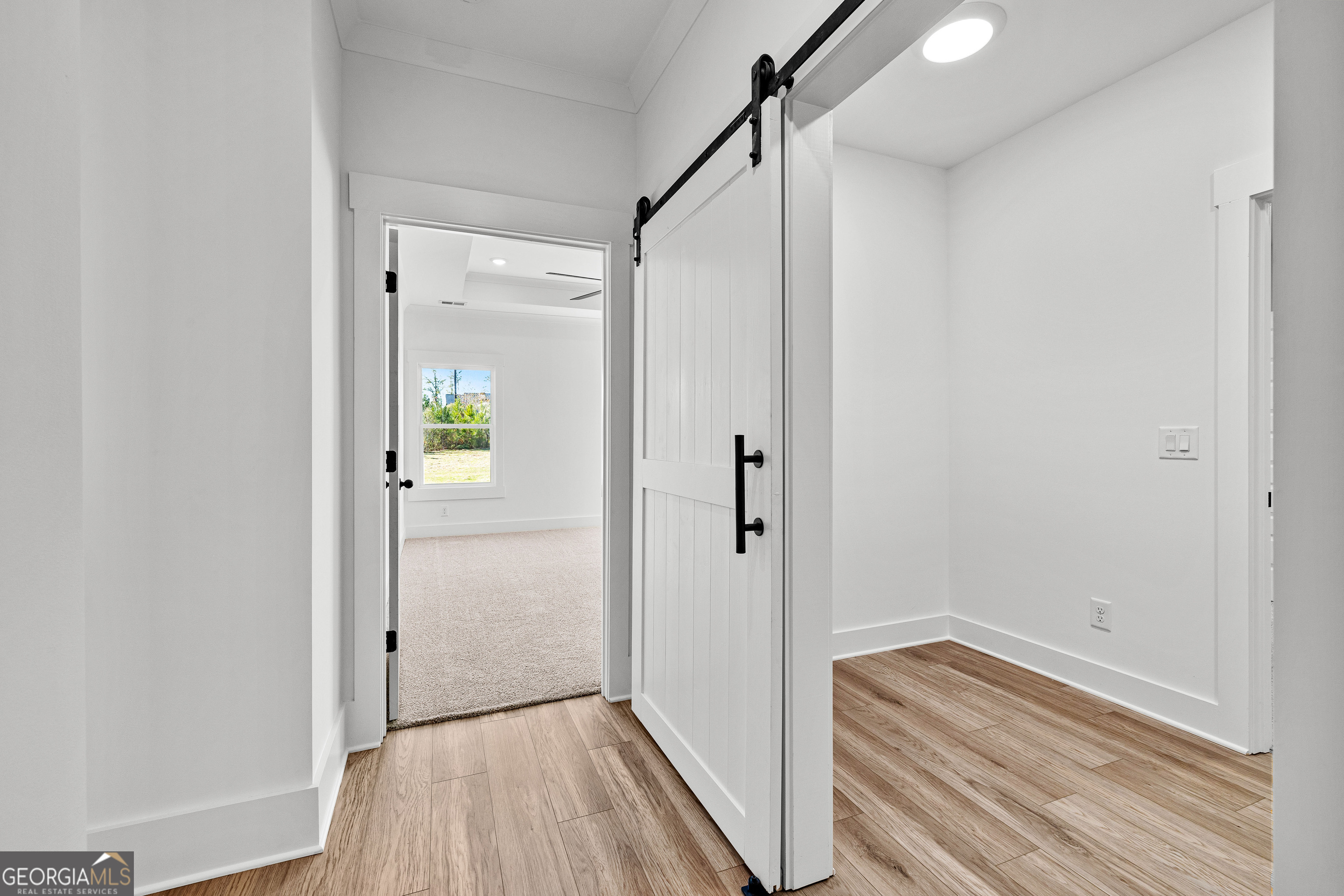 374 Conner Lane Williamson, GA 30292 - Photo 25 of 52 a view of a hallway with wooden floor and a bathroom