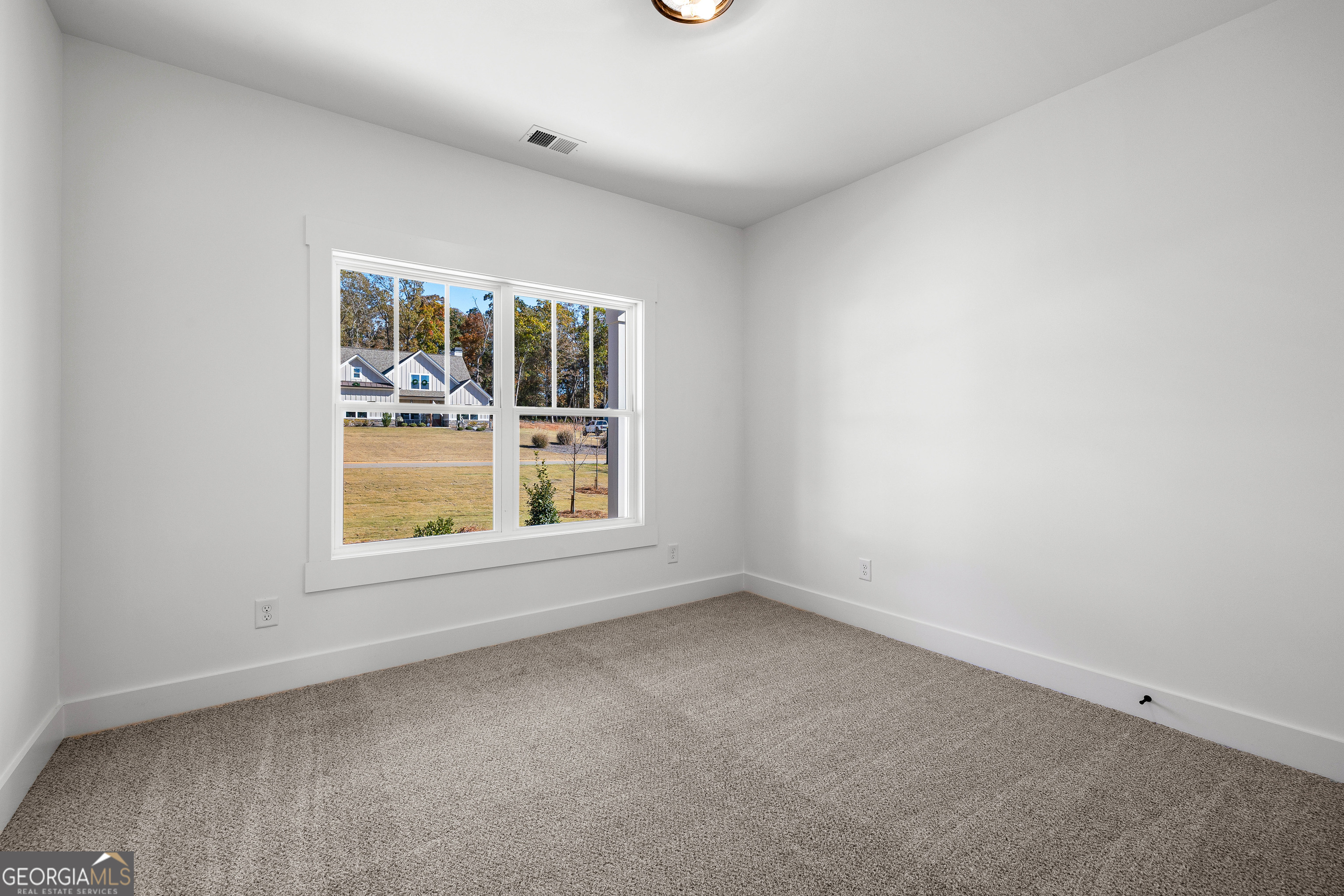 374 Conner Lane Williamson, GA 30292 - Photo 27 of 52 an empty room with a window