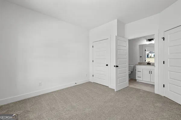 an empty room with white cabinet