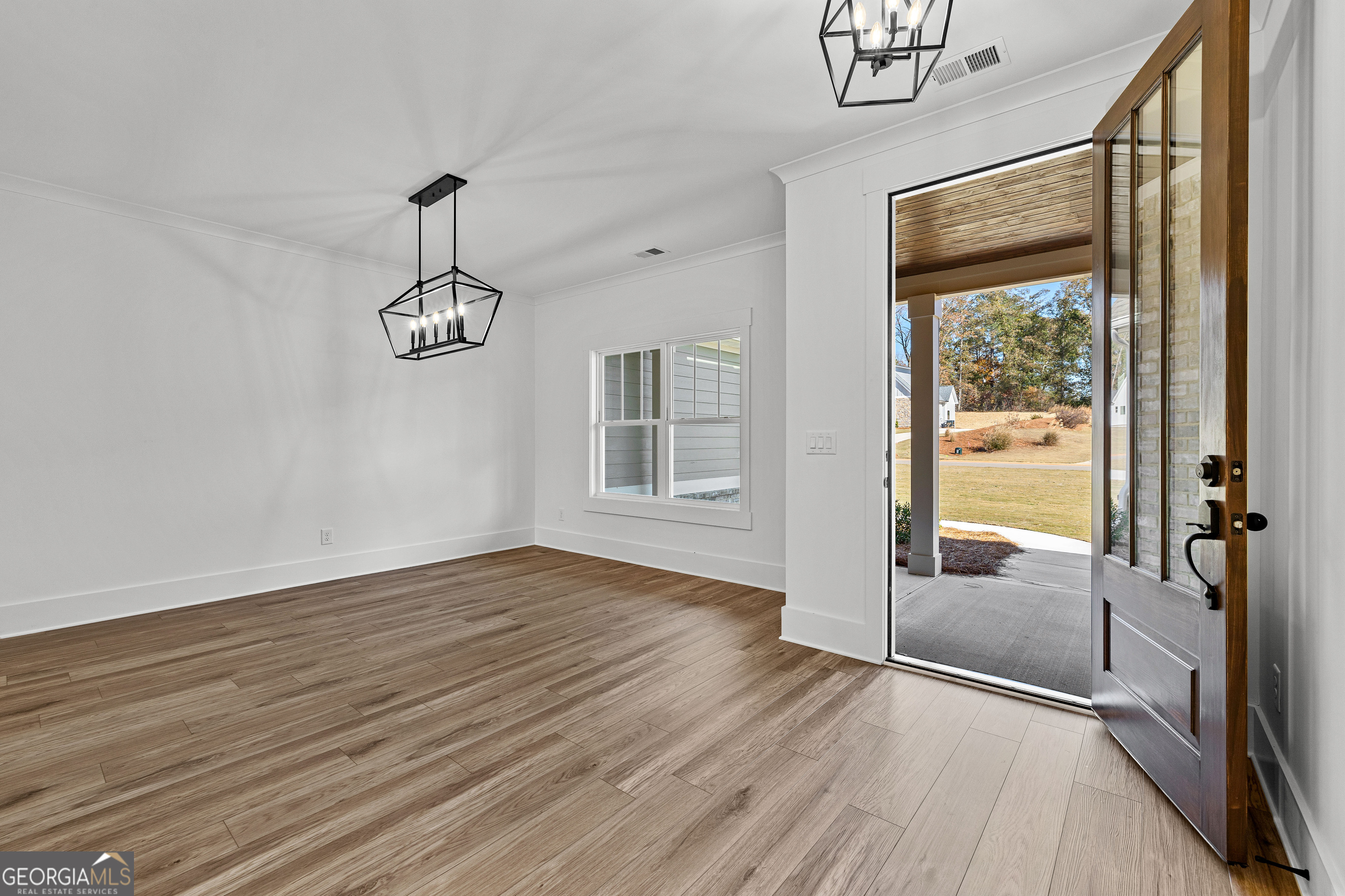 374 Conner Lane Williamson, GA 30292 - Photo 4 of 52 a view of empty room with wooden floor and fan