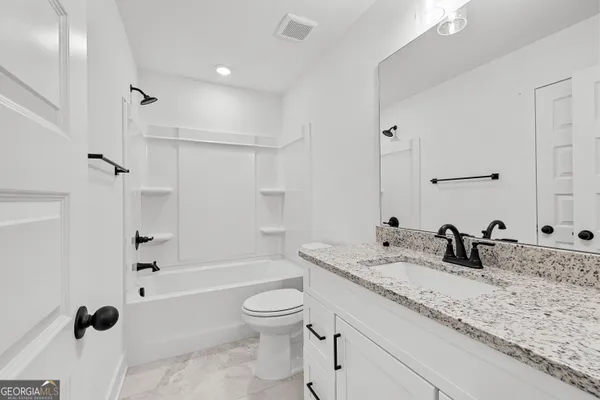 a view of a patio with a lake view