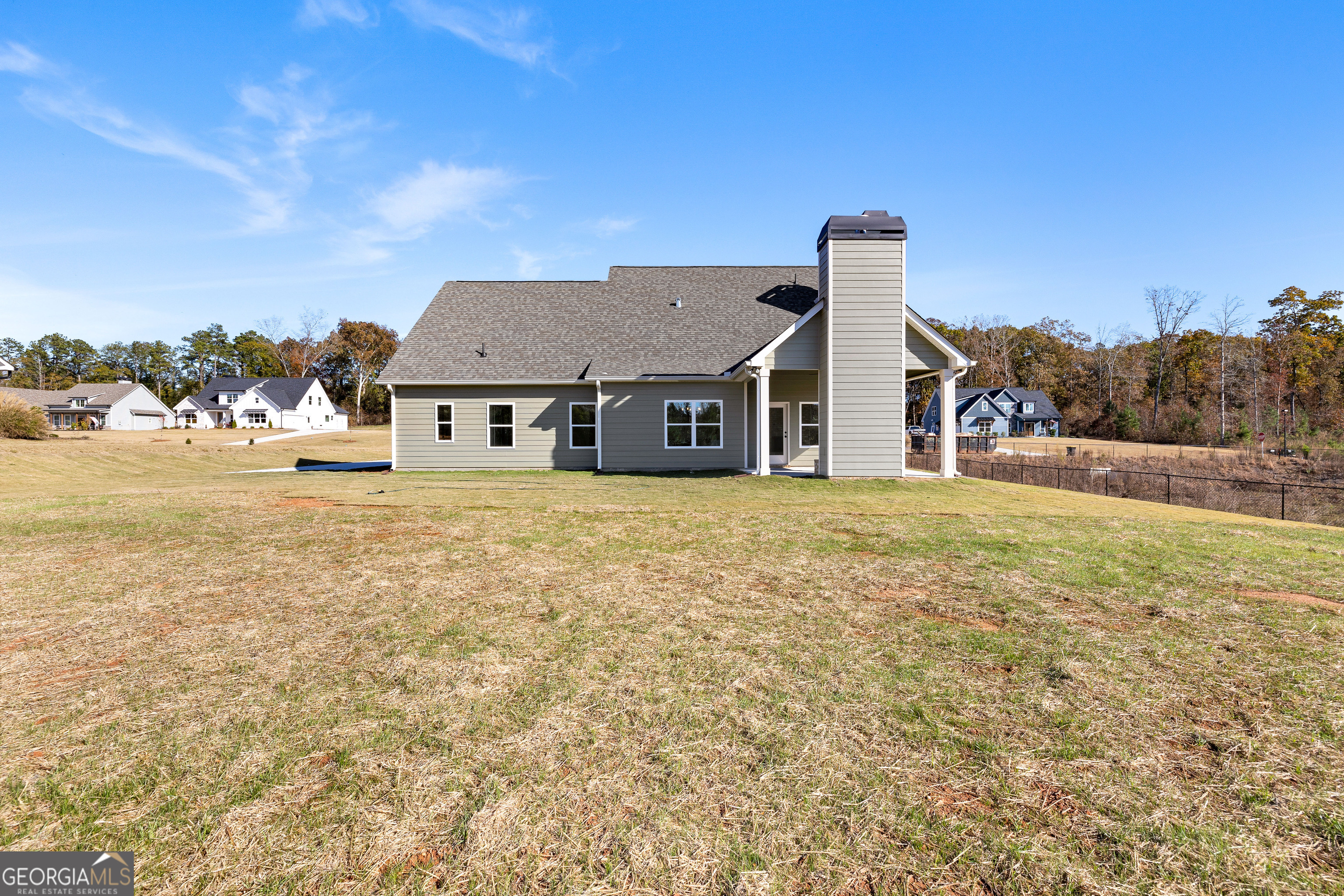 374 Conner Lane Williamson, GA 30292 - Photo 48 of 52 a front view of a house with a garden and tree