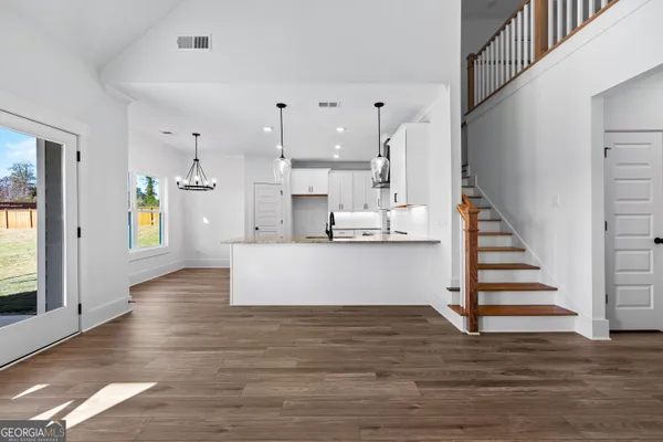 a view of kitchen with cabinets and wooden floor