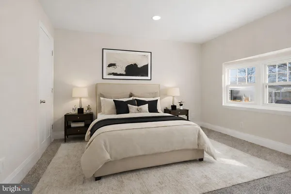 a bedroom with bed and a window