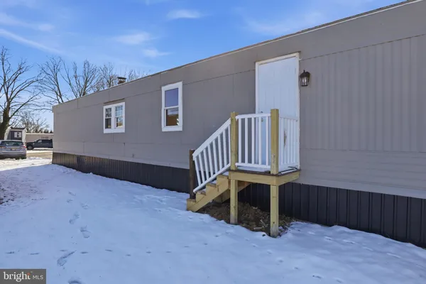a view of outdoor space with deck and furniture