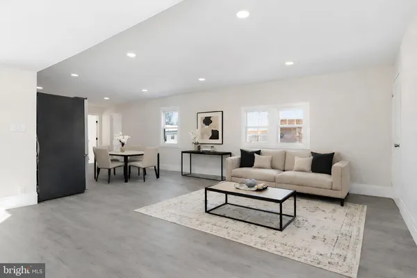 a living room with furniture and a table