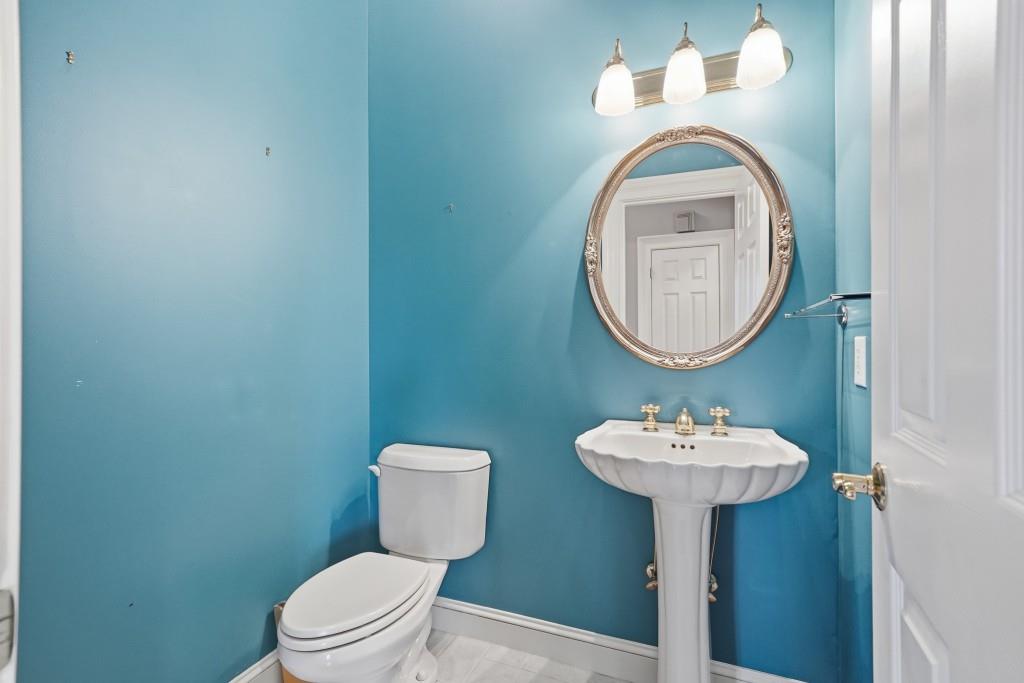774 Bray Road Southwest Calhoun, GA 30701 - Photo 29 of 106 a bathroom with a sink toilet and a mirror