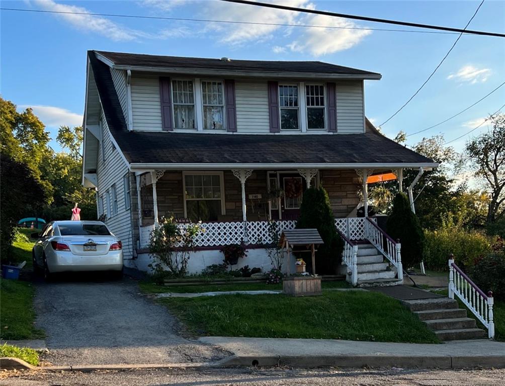 740 Chestnut Street New Castle, PA 16101 - Photo 1 of 16 a front view of a house with a garden and plants
