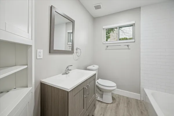 a bathroom with a sink toilet and a bathtub