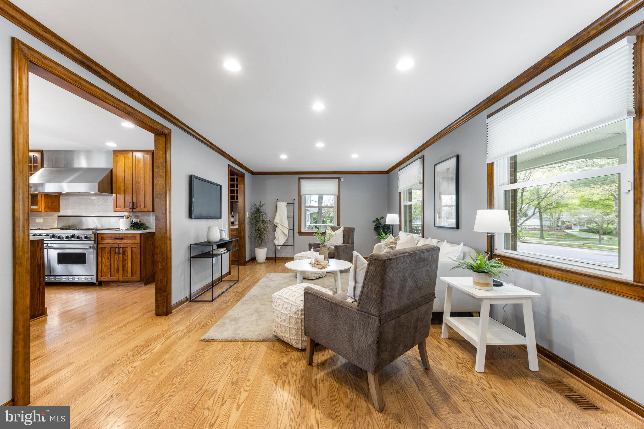 8735 Doves Fly Way Laurel, MD 20723 - Photo 12 of 64 a living room with fireplace furniture and a large window