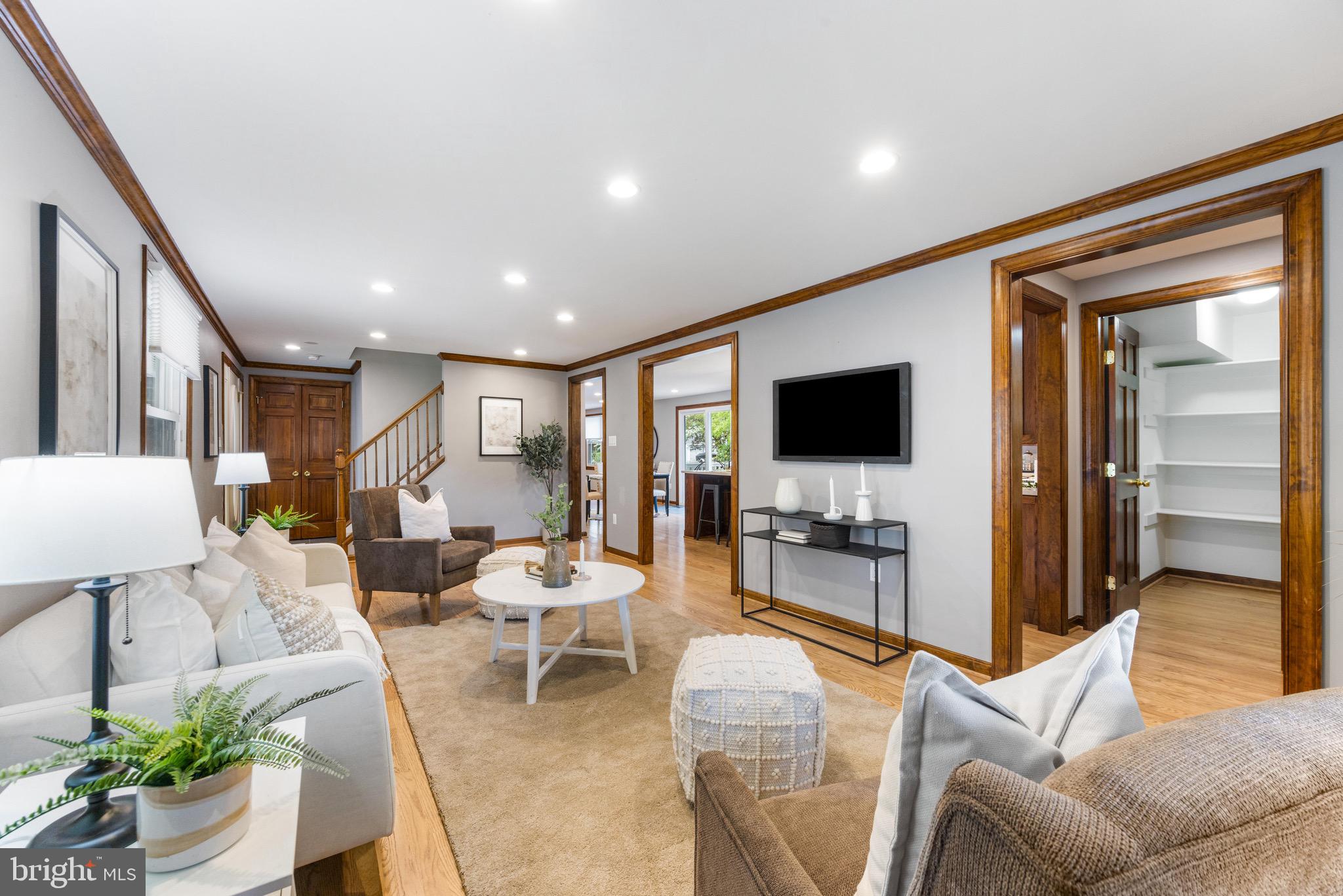 8735 Doves Fly Way Laurel, MD 20723 - Photo 14 of 64 a living room with furniture and a flat screen tv