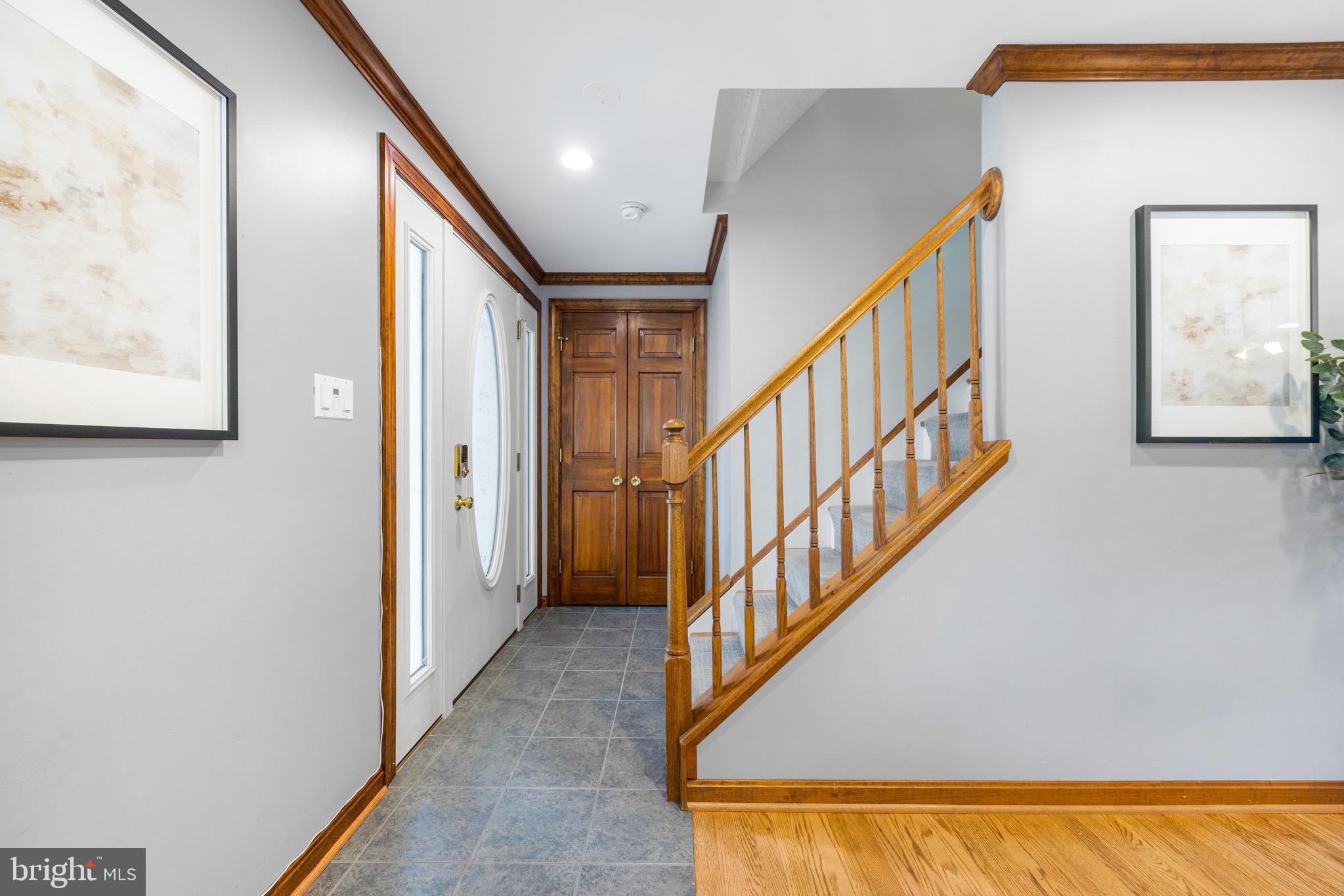 8735 Doves Fly Way Laurel, MD 20723 - Photo 16 of 64 a view of an entryway with wooden floor